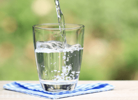A Glass Of Water Being Poured Into A Glass