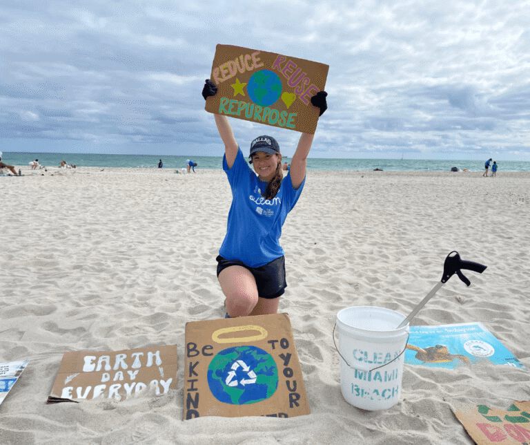 Image Of Chelsea Echeverria With Clean Miami Beach Clean-Up Volunteers For Event Sponsored By The Downs Law Group Titled &Quot;I Love The Ocean&Quot;