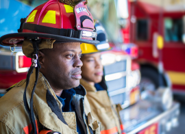 A Firefighter And A Firetruck
