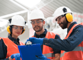 Image Of Construction Workers Looking At Blue Prints To Work