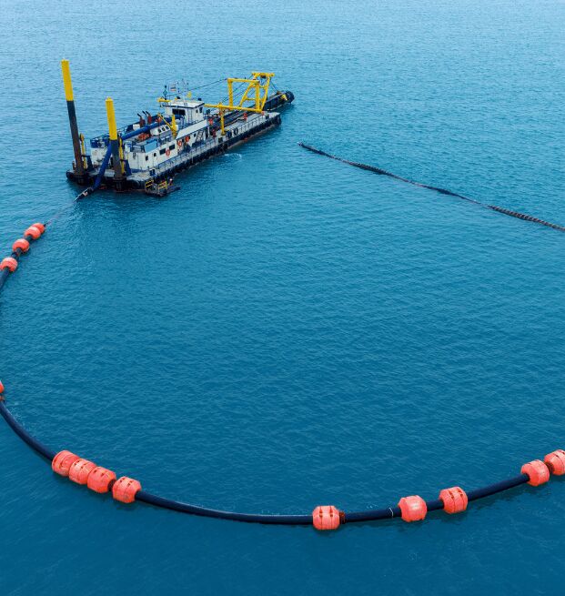 Boat Working Bp Oil Spill With Booms Out To Collect Oil