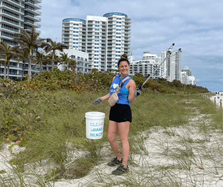 Image of Dorothy Harrison Law Clerk with Clean Miami Beach clean-up volunteers for event sponsored by The Downs Law Group titled "I Love The Ocean"